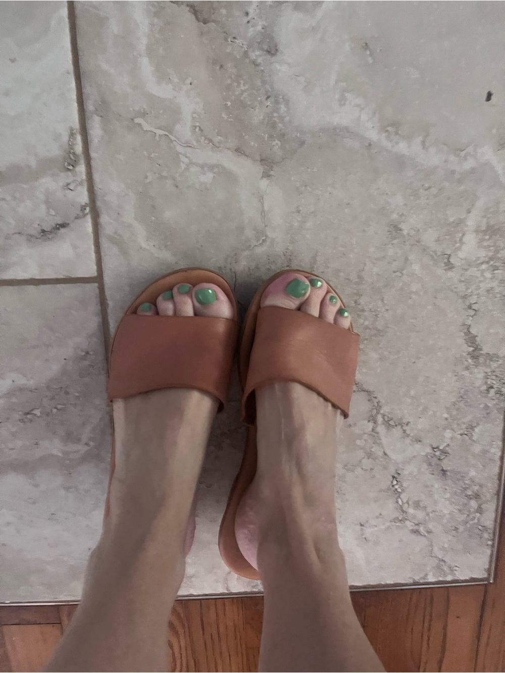 Well worn leather slides